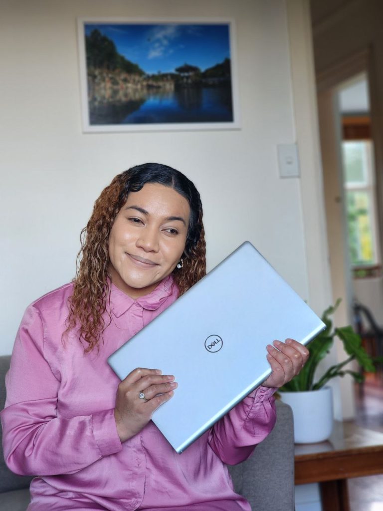 Young woman holding a laptop